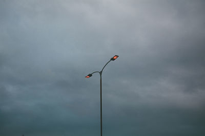 Telephone pole against sky