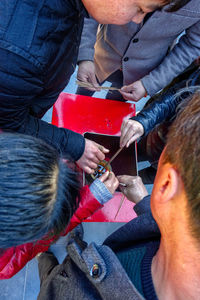 High angle view of couple holding hands