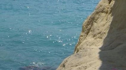 Scenic view of sea against blue sky