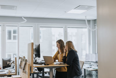 Women working together in office