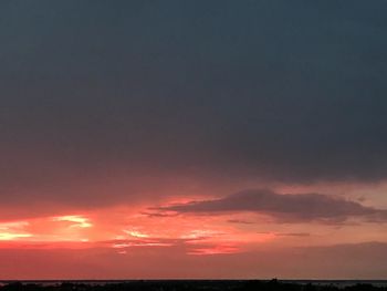 Scenic view of dramatic sky over sea during sunset