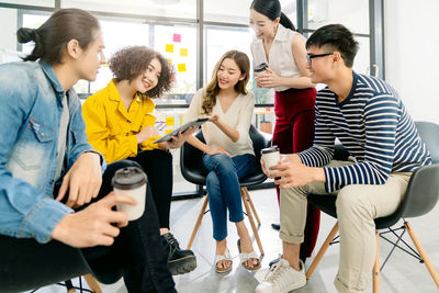 Group of people sitting in corridor