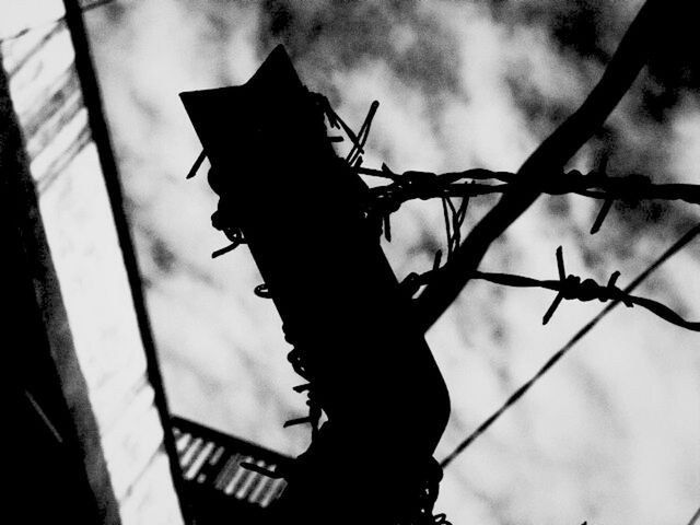 sky, cloud - sky, metal, cloudy, focus on foreground, low angle view, day, protection, close-up, outdoors, part of, weather, one person, cloud, railing, safety, cropped, danger, hanging