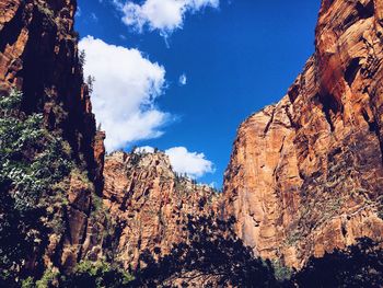 Low angle view of rock formations against sky