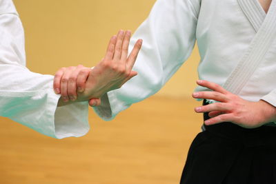 Close-up of couple holding hands