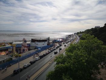 High angle view of road by sea against sky