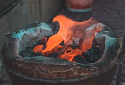 Close-up of fire on wood