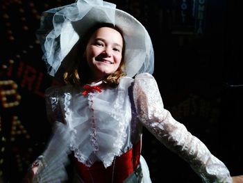 Portrait of smiling young woman in costume