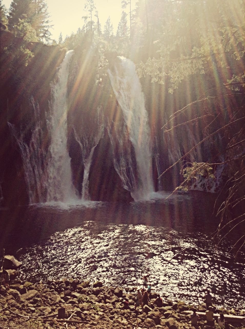 water, motion, sunbeam, sunlight, nature, long exposure, flowing water, splashing, beauty in nature, rock - object, tranquility, scenics, tranquil scene, flowing, lens flare, forest, day, outdoors, no people, waterfall