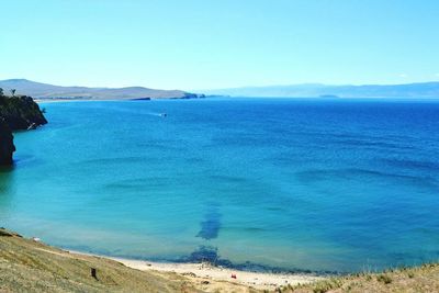 Scenic view of sea against clear blue sky