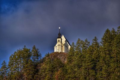 Low angle view of bell tower against sky