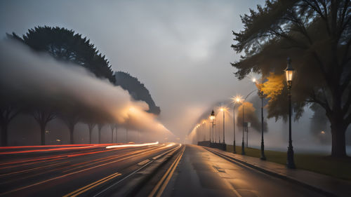 High angle view of light trails on road at night