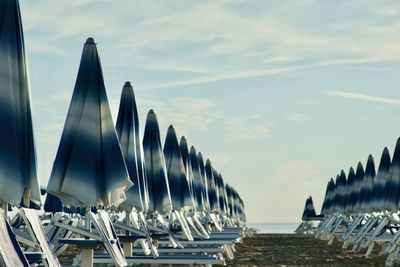 Panoramic view of boats moored in sea against sky