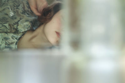 Close-up of woman sleeping on bed