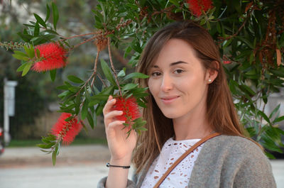 Close-up of young woman holding fruits