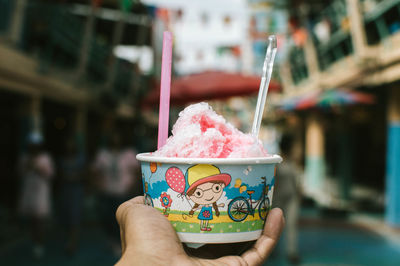 Person holding ice cream cone