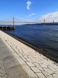 View of suspension bridge over sea