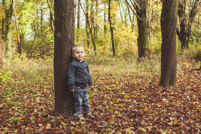 Portrait of smiling boy in forest