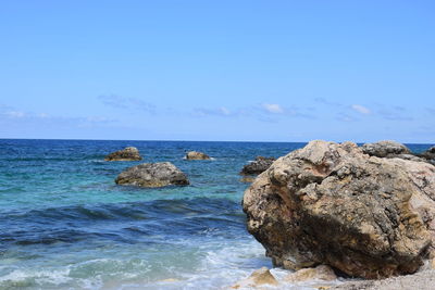 Scenic view of sea against blue sky