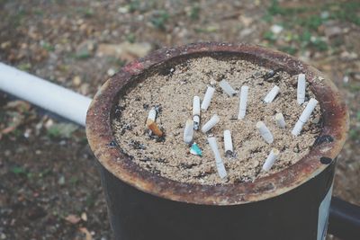 High angle view of cigarette smoking on metal