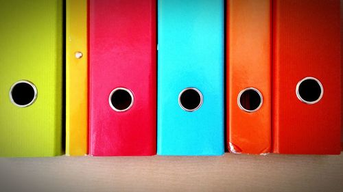 Close-up of colorful ring binders