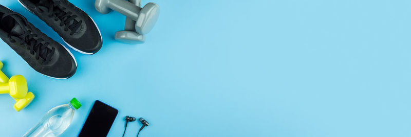 High angle view of shoes on table against blue background