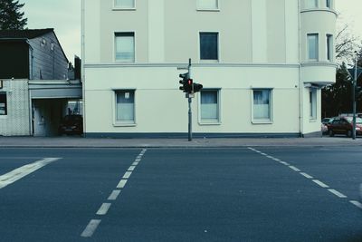 Vehicles on road along buildings