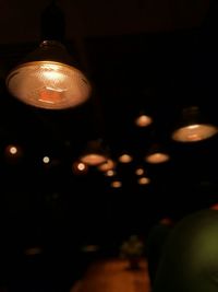 Illuminated lanterns hanging at night