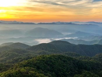 Scenic view of mountains against sky during sunset