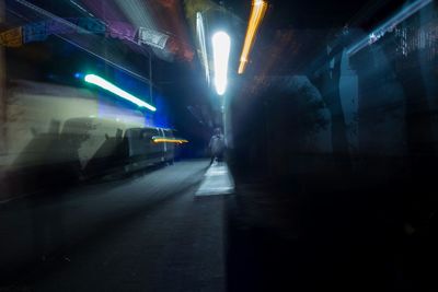 Illuminated street lights in city at night