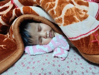 Cute baby sleeping on the bed