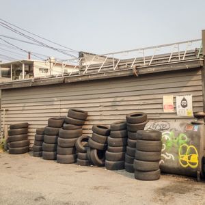 Stack of firewood against clear sky