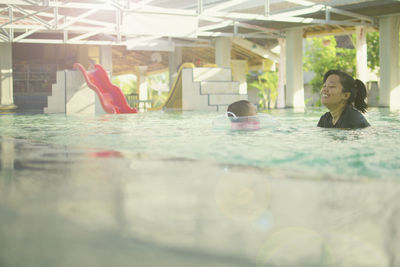 Woman swimming in pool