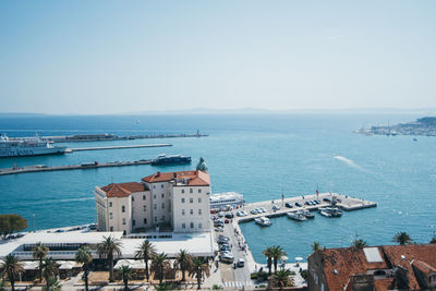 High angle view of boats moored at harbor