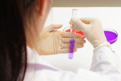 Close-up of pipette with purple liquid