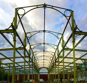 Low angle view of metal structure against sky