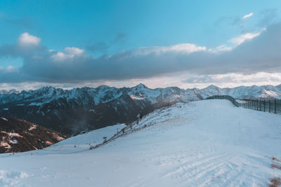 Scenic view of snowcapped mountains against sky