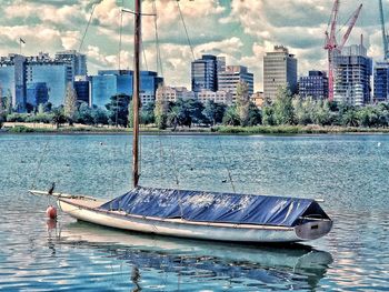 View of city at waterfront against sky