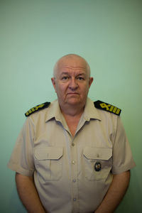 Portrait of man wearing mask against white background