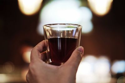 Close-up of hand holding drink