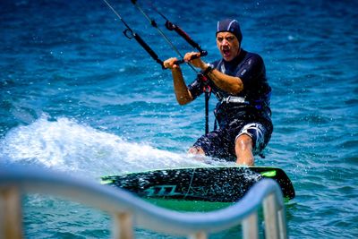 Full length of a man jumping on sea