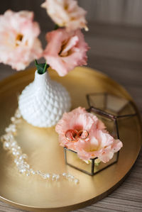 Close-up of wedding rings on table