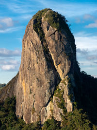 Low angle view of rock formations against sky