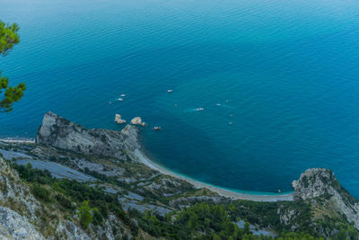 High angle view of rocks by sea