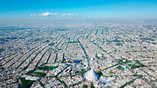 High angle view of city buildings against sky