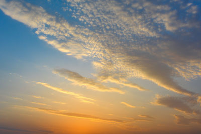 Low angle view of dramatic sky during sunset