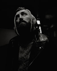 Portrait of young man looking away outdoors