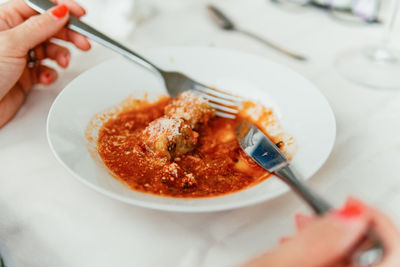 Cropped hand of person having food