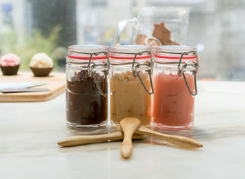 Close-up of food in jars on table