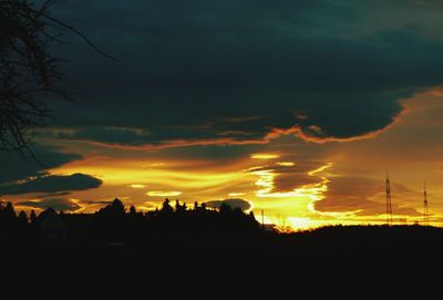 Silhouette of landscape against dramatic sky